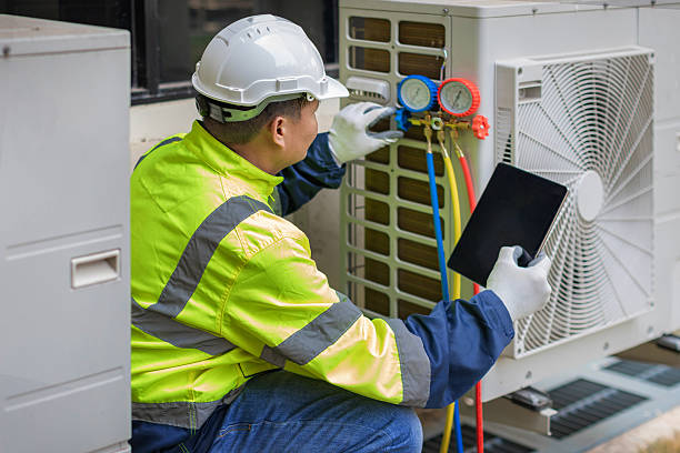 Professional Heat Pump Repair technician working in Connersville, IN